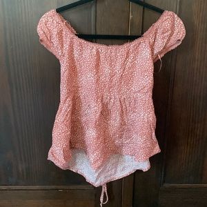 Blush colored flowey off the shoulder-ish top with an open back.